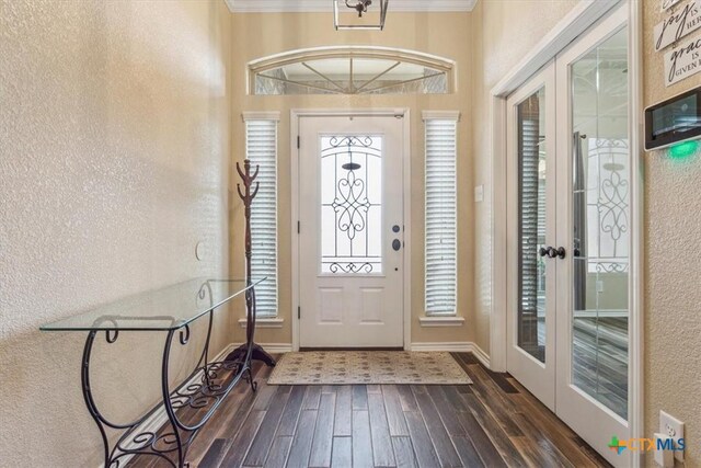 5907 Verde Dr, Killeen, TX 76549 - entryway featuring french doors, a textured wall, wood finished floors, ornamental molding, and baseboards