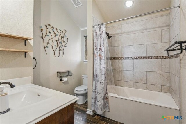 5907 Verde Dr, Killeen, TX 76549 - bathroom with toilet, wood finished floors, shower / tub combo, and vanity