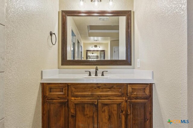 5907 Verde Dr, Killeen, TX 76549 - bathroom featuring a textured wall and vanity