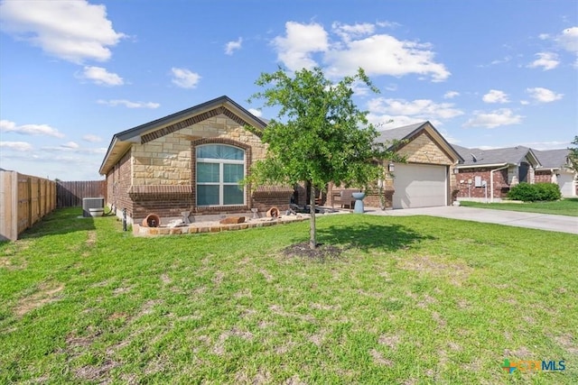5907 Verde Dr, Killeen, TX 76549 - view of front of home featuring concrete driveway, central air condition unit, brick siding, an attached garage, and stone siding