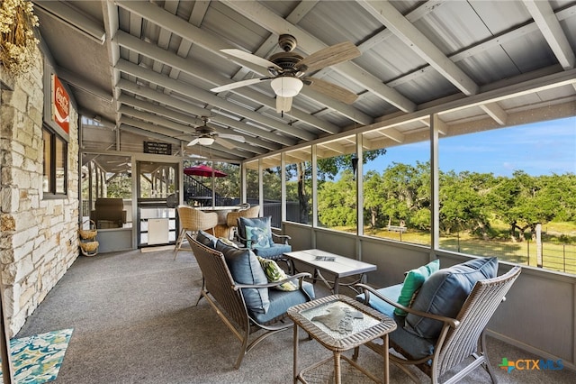 sunroom / solarium featuring an outdoor living space, beamed ceiling, and ceiling fan