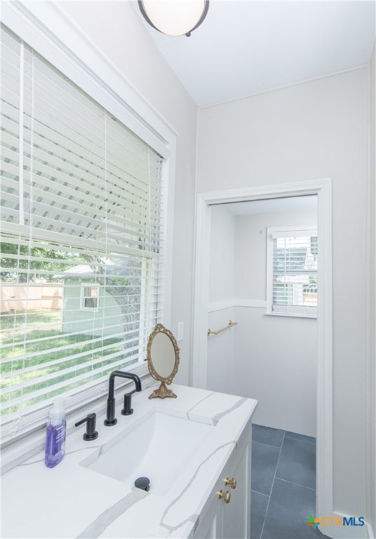bathroom with vanity and tile patterned floors