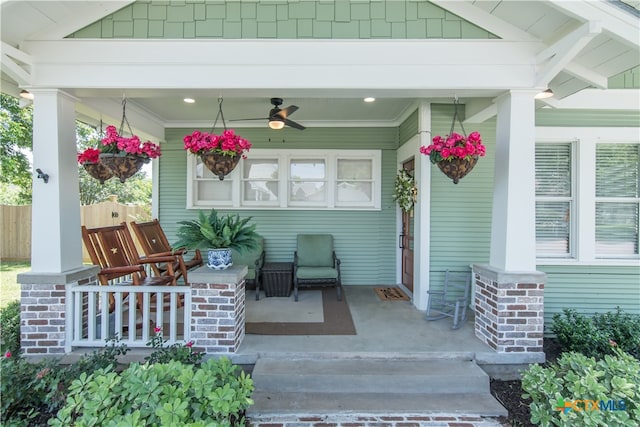 property entrance with ceiling fan and a porch