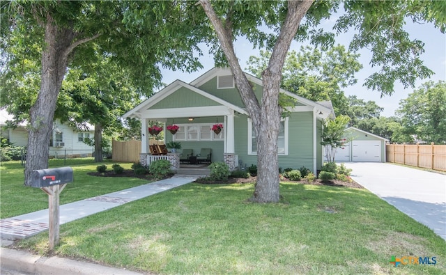 craftsman house with a garage and a front yard