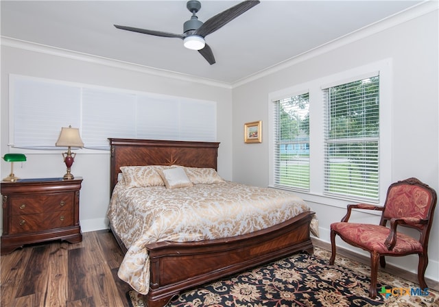 bedroom featuring ornamental molding, ceiling fan, and dark hardwood / wood-style floors