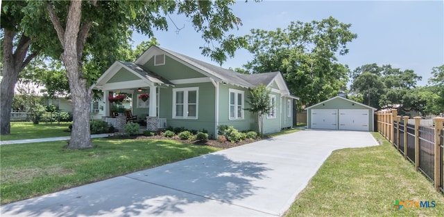 view of front of home featuring covered porch, a garage, an outdoor structure, and a front lawn