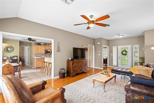 4 Longview Dr, Victoria, TX 77904 - living area with a ceiling fan, light wood-style flooring, baseboards, and vaulted ceiling