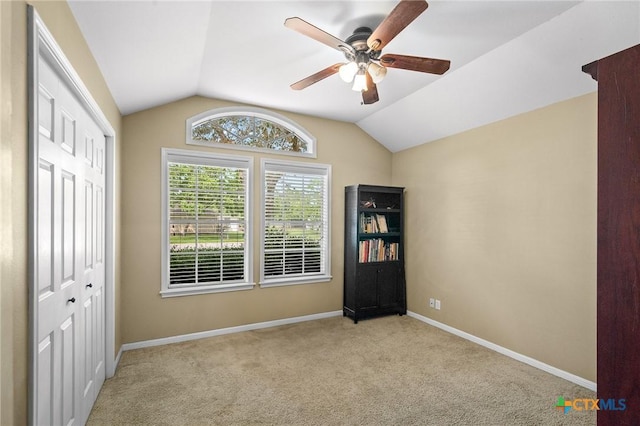 4 Longview Dr, Victoria, TX 77904 - unfurnished bedroom featuring lofted ceiling, carpet floors, baseboards, a closet, and ceiling fan