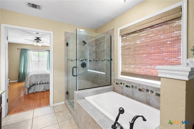 4 Longview Dr, Victoria, TX 77904 - ensuite bathroom featuring a bath, tile patterned floors, a shower stall, ceiling fan, and baseboards