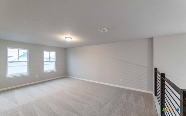 308 Angus Dr, Seguin, TX 78155 - spare room featuring visible vents, baseboards, and carpet