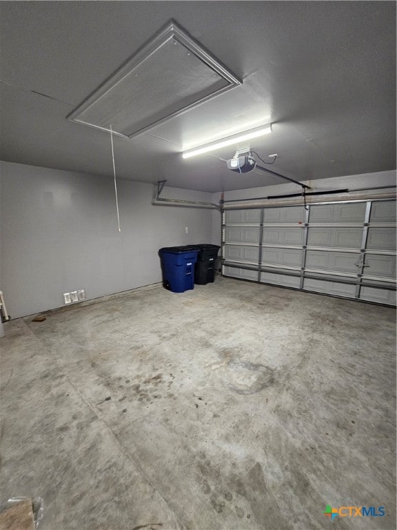 garage featuring a garage door opener