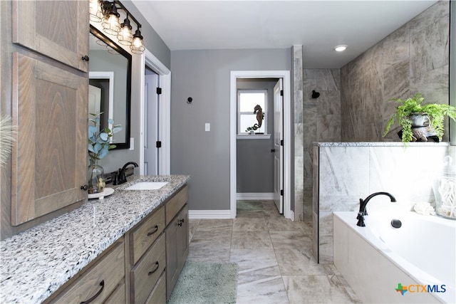 bathroom featuring separate shower and tub and vanity