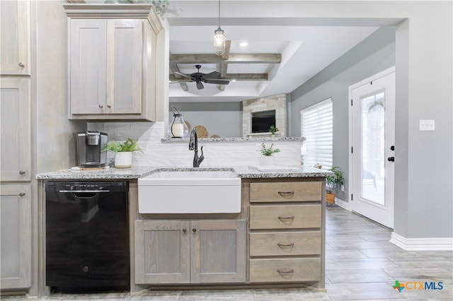 kitchen with light stone counters, ceiling fan, sink, beam ceiling, and black dishwasher