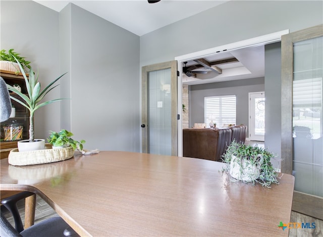 dining space with wood-type flooring and french doors