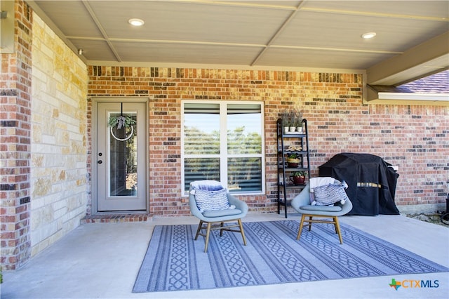 view of patio featuring a grill