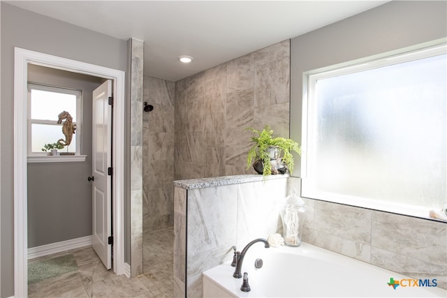 bathroom featuring plus walk in shower