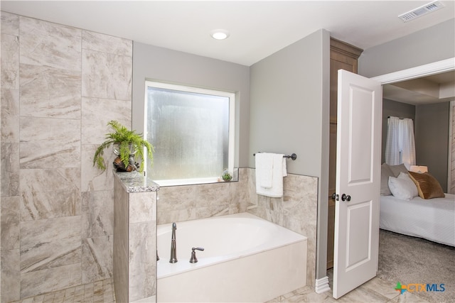 bathroom featuring a tub