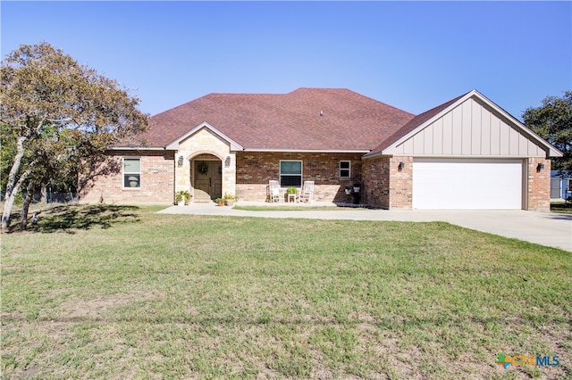 single story home with a front lawn and a garage