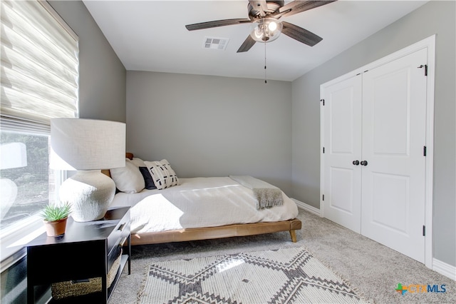 bedroom featuring carpet flooring, a closet, and ceiling fan