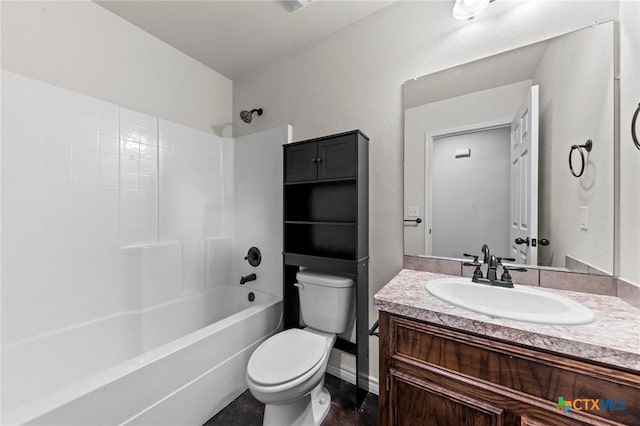 full bathroom with toilet, vanity, and washtub / shower combination