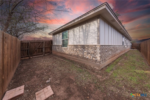 view of property exterior at dusk