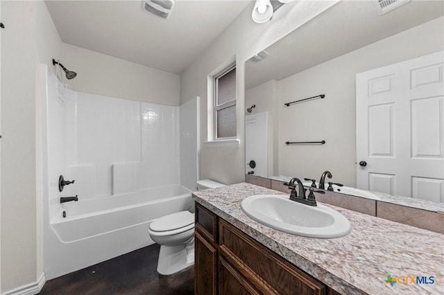 full bathroom with toilet, vanity, and bathing tub / shower combination