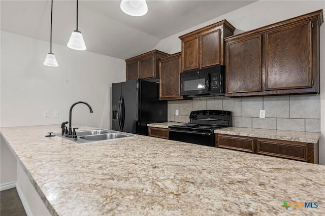 kitchen featuring dark brown cabinetry, black appliances, decorative backsplash, sink, and hanging light fixtures