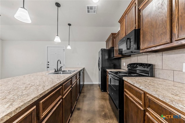 kitchen featuring black appliances, decorative light fixtures, sink, and decorative backsplash