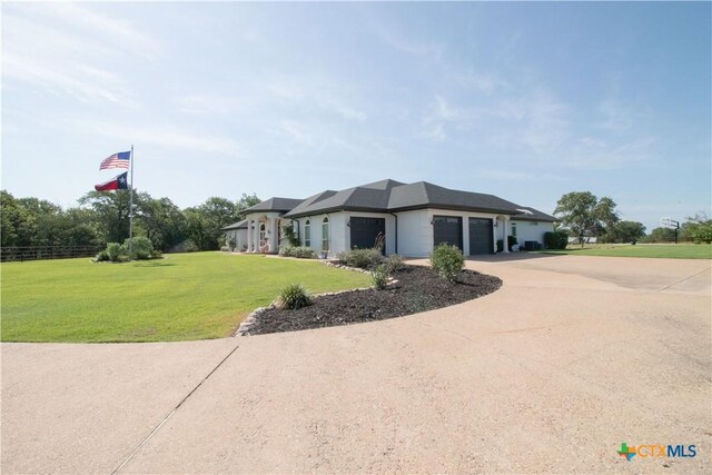 547 Powder Rdg, Luling, TX 78648 - view of front of house featuring a garage, a front lawn, and driveway