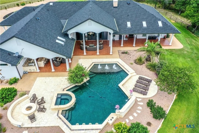 547 Powder Rdg, Luling, TX 78648 - rear view of property featuring roof with shingles, an outdoor fire pit, a patio area, and a gazebo