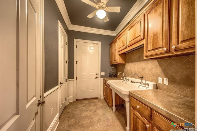 547 Powder Rdg, Luling, TX 78648 - laundry area with crown molding, a ceiling fan, and light tile patterned floors