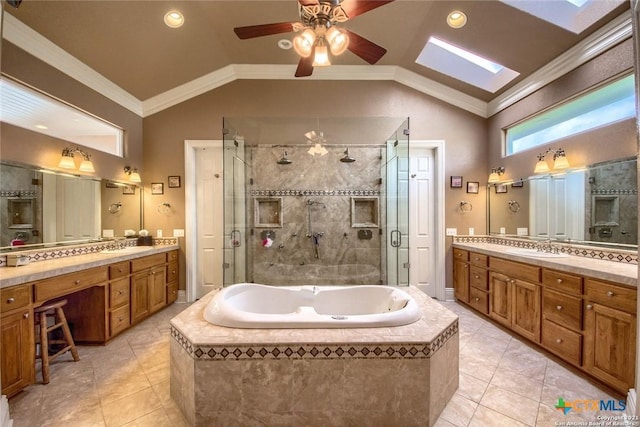 547 Powder Rdg, Luling, TX 78648 - bathroom featuring a skylight, a stall shower, a bath, vaulted ceiling, and vanity