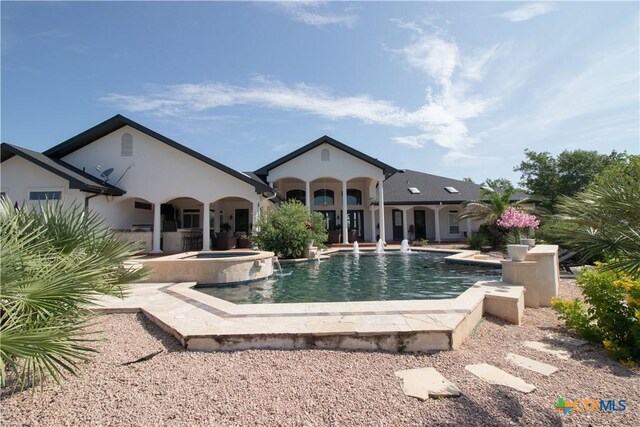 547 Powder Rdg, Luling, TX 78648 - outdoor pool featuring an in-ground hot tub and a patio area
