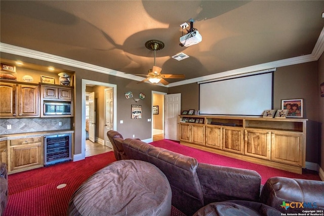 547 Powder Rdg, Luling, TX 78648 - carpeted home theater room featuring beverage cooler, ornamental molding, a ceiling fan, and bar area
