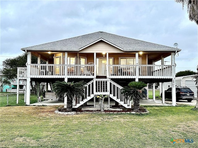 rear view of property with a patio area and a yard