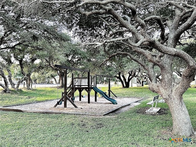 view of playground featuring a lawn