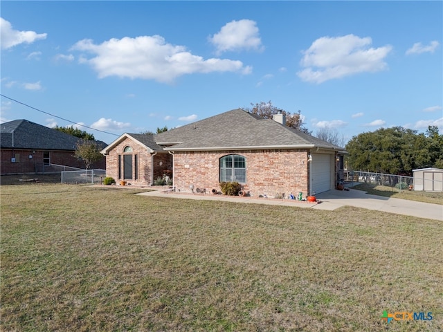 ranch-style house with a front yard and a garage