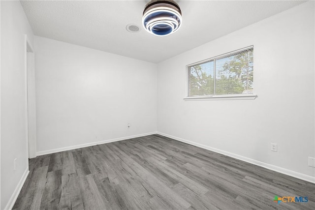 1206 Amthor Ave, Copperas Cove, TX 76522 - unfurnished room featuring dark wood-style floors and baseboards