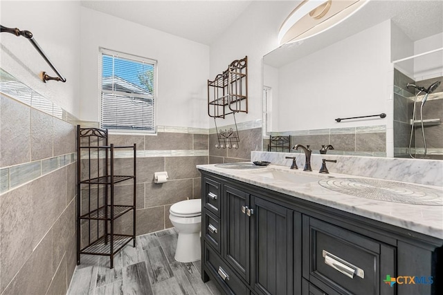 1206 Amthor Ave, Copperas Cove, TX 76522 - full bath with tile walls, toilet, vanity, tiled shower, and wood finished floors