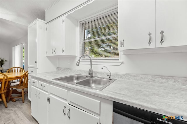 1206 Amthor Ave, Copperas Cove, TX 76522 - kitchen with a sink, light countertops, healthy amount of natural light, and white cabinets