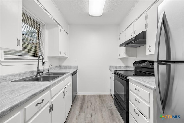 1206 Amthor Ave, Copperas Cove, TX 76522 - kitchen with stainless steel appliances, under cabinet range hood, a sink, a textured ceiling, and light countertops