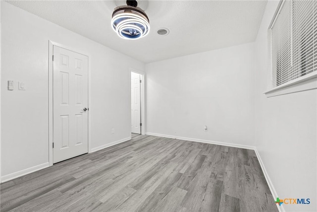1206 Amthor Ave, Copperas Cove, TX 76522 - spare room featuring wood finished floors and baseboards