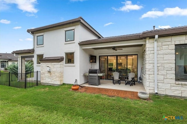 119 Rivalto Dr, Horseshoe Bay, TX 78657 - rear view of house with stone siding, a patio area, a ceiling fan, and stucco siding