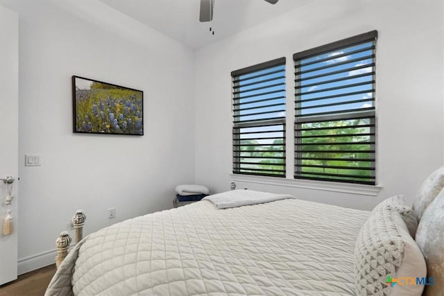119 Rivalto Dr, Horseshoe Bay, TX 78657 - bedroom featuring wood finished floors, a ceiling fan, and baseboards