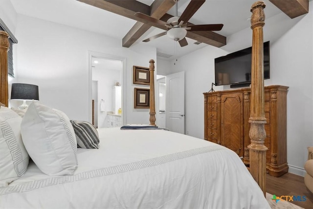 119 Rivalto Dr, Horseshoe Bay, TX 78657 - bedroom with wood finished floors, a ceiling fan, ensuite bath, baseboards, and beam ceiling