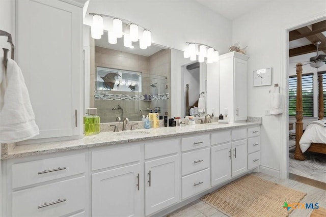 119 Rivalto Dr, Horseshoe Bay, TX 78657 - full bath with ensuite bath, double vanity, a stall shower, and beamed ceiling