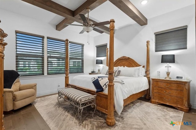 119 Rivalto Dr, Horseshoe Bay, TX 78657 - bedroom with wood finished floors, baseboards, beamed ceiling, coffered ceiling, and a ceiling fan