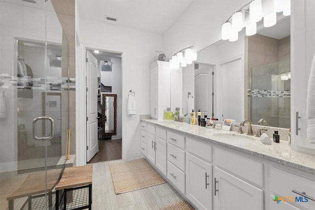 119 Rivalto Dr, Horseshoe Bay, TX 78657 - bathroom featuring double vanity and a stall shower