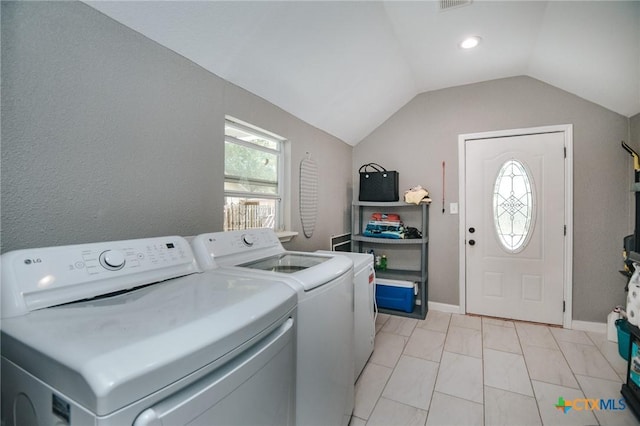 laundry room featuring separate washer and dryer, laundry area, and marble finish floor