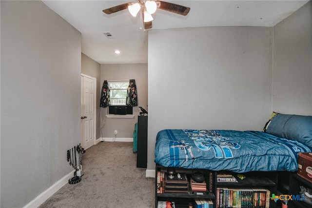 bedroom featuring visible vents, a ceiling fan, baseboards, and carpet floors